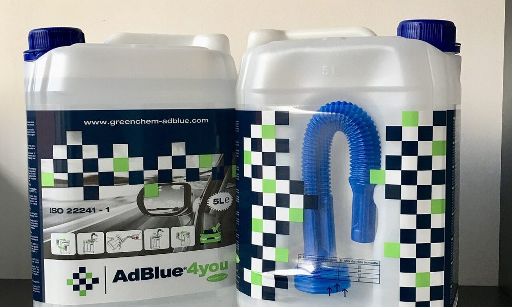 Five-liter diesel exhaust fluid containers with dedicated refill spout