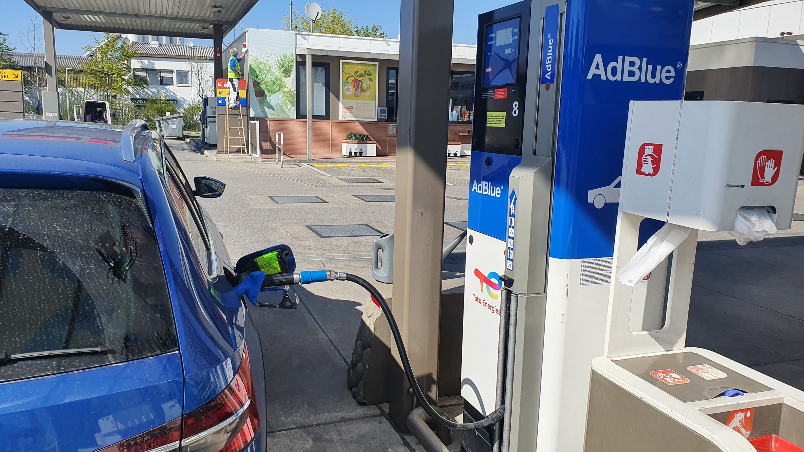 Diesel vehicle refilling diesel exhaust fluid at a dedicated DEF pump